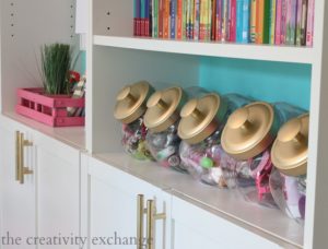Use candy jars to organize your daughter's accessories. Repin if you think this is brilliant!