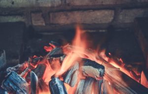 Sprinkle wet coffee grounds in your fireplace before cleaning. This will help prevent dust getting into the air as well as make it easier to clean. 