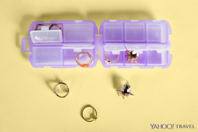 When traveling you should buy a pill case from the dollar store to organize small jewelry. 